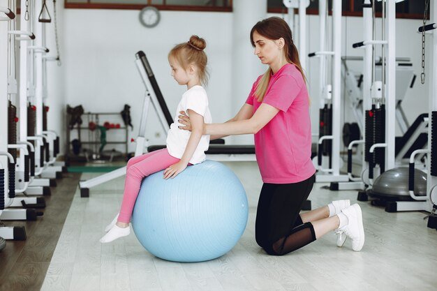 YMCA gym showing kids play area while parents exercise